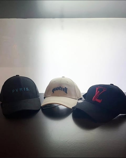 Three baseball caps