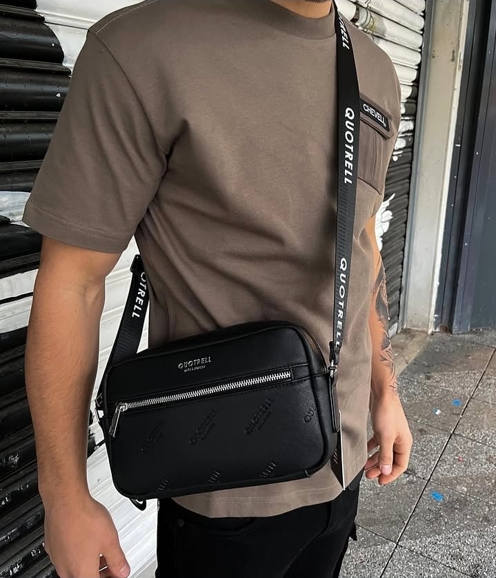 Man with Quotrell crossbody bag outdoors